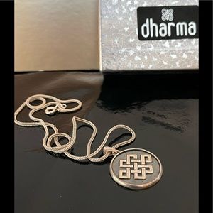 Silver Eternity knot pendant on an intricately woven flat weave 16” silver chain